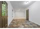 Sunroom entryway boasts stone tile flooring and a door to the exterior with sidelight windows at 3570 Bardfield Ct, Cumming, GA 30041