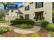 Beautiful white home featuring lush landscaping, a two-car garage and a welcoming front entrance at 3570 Bardfield Ct, Cumming, GA 30041