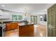 Open kitchen features stainless appliances, island, and view to breakfast nook at 3570 Bardfield Ct, Cumming, GA 30041