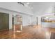 Bright living room features hardwood floors and access to the entry hall and kitchen at 3570 Bardfield Ct, Cumming, GA 30041
