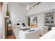 Bright living area with tall ceilings, fireplace, modern furniture, and stylish decor at 3570 Bardfield Ct, Cumming, GA 30041
