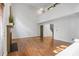 Open living room with hardwood floors and lots of natural light with view of upper level at 3570 Bardfield Ct, Cumming, GA 30041