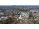 Scenic aerial view of new construction homes in a wooded neighborhood with mountain backdrop at 4410 Ross Estates Ct, Snellville, GA 30039