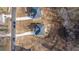 Aerial view featuring two homes with gray roof, long driveways and sparse trees at 4410 Ross Estates Ct, Snellville, GA 30039