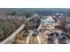 Aerial view showcasing a new two-story home with a partial image inset at 4410 Ross Estates Ct, Snellville, GA 30039