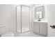 Modern bathroom includes glass enclosed shower, white vanity, and tile flooring at 4410 Ross Estates Ct, Snellville, GA 30039