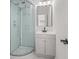 Clean bathroom with a glass enclosed shower, modern vanity and mirror at 4410 Ross Estates Ct, Snellville, GA 30039