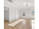 Spacious bedroom featuring hardwood floors and an open closet at 4410 Ross Estates Ct, Snellville, GA 30039