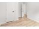 Bright bedroom with light wood floors and white doors at 4410 Ross Estates Ct, Snellville, GA 30039