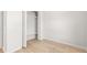 Bedroom with white trim, light-colored wood flooring and an open closet at 4410 Ross Estates Ct, Snellville, GA 30039
