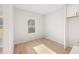 Cozy bedroom with hardwood floors, natural light, and closet at 4410 Ross Estates Ct, Snellville, GA 30039