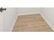 Empty closet shows newly installed light-wood flooring and white trim at 4410 Ross Estates Ct, Snellville, GA 30039