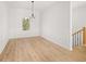 Elegant dining room with wainscoting, chandelier, and wood floors at 4410 Ross Estates Ct, Snellville, GA 30039