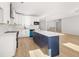 Stylish kitchen featuring white cabinets, a kitchen island, and stainless steel appliances at 4410 Ross Estates Ct, Snellville, GA 30039