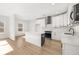 Bright kitchen features white cabinets, stainless steel appliances, and center island at 4410 Ross Estates Ct, Snellville, GA 30039
