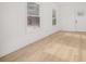 Living room with bright light, hardwood floors, and nature views at 4410 Ross Estates Ct, Snellville, GA 30039