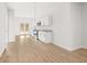 Open living space with stainless steel appliances, and white cabinets at 4410 Ross Estates Ct, Snellville, GA 30039