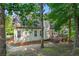 Charming home with a large backyard, wooden deck, mature trees and natural landscape at 5923 Rosie Se Ln, Mableton, GA 30126