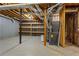 Spacious unfinished basement with shelving and mechanical components at 5923 Rosie Se Ln, Mableton, GA 30126