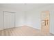 Bedroom with neutral walls, plush carpeting, and double door closet at 5923 Rosie Se Ln, Mableton, GA 30126