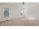 Spacious bedroom with neutral colors, large windows and a ceiling fan at 5923 Rosie Se Ln, Mableton, GA 30126