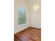 Bright dining room with hard wood floors, chandelier, and large window at 5923 Rosie Se Ln, Mableton, GA 30126