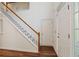 Bright foyer with hardwood floors, staircase, and natural light from sidelight windows at 5923 Rosie Se Ln, Mableton, GA 30126
