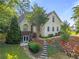Charming two-story home featuring a lush landscaped front yard and inviting entryway at 5923 Rosie Se Ln, Mableton, GA 30126