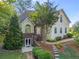 Charming two-story home featuring a lush landscaped front yard and inviting entryway at 5923 Rosie Se Ln, Mableton, GA 30126