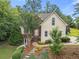 Charming two-story home featuring a lush landscaped front yard and inviting entryway at 5923 Rosie Se Ln, Mableton, GA 30126