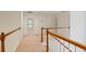 Hallway with white railings and natural wood accents at 5923 Rosie Se Ln, Mableton, GA 30126