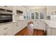 Updated kitchen features stainless steel appliances, white cabinets and marble backsplash at 5923 Rosie Se Ln, Mableton, GA 30126