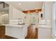 Bright updated kitchen with white cabinets, stainless steel appliances and hard wood floors at 5923 Rosie Se Ln, Mableton, GA 30126