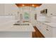 Bright updated kitchen features stainless appliances, marble backsplash and hard wood floors at 5923 Rosie Se Ln, Mableton, GA 30126