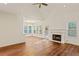 Bright living area with fireplace and large windows providing plenty of natural light at 5923 Rosie Se Ln, Mableton, GA 30126