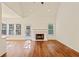 Open living space with fireplace and large windows offering plenty of natural light at 5923 Rosie Se Ln, Mableton, GA 30126