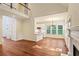 Open living space featuring hardwood floors, fireplace and connected kitchen area at 5923 Rosie Se Ln, Mableton, GA 30126