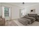 Relaxing main bedroom with neutral colors, large windows and ceiling fan at 5923 Rosie Se Ln, Mableton, GA 30126