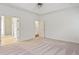 Spacious main bedroom with neutral carpet and paint; an en suite bathroom is visible at 5923 Rosie Se Ln, Mableton, GA 30126