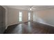 Large bedroom with two bright windows, modern flooring, and a ceiling fan at 7156 Whitfield Drive Dr, Riverdale, GA 30296