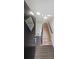 Bright foyer featuring hardwood floors and stairs leading to the upper level at 7156 Whitfield Drive Dr, Riverdale, GA 30296
