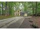 Two-story home featuring a long driveway and a well-maintained front yard at 7156 Whitfield Drive Dr, Riverdale, GA 30296