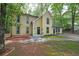 Two-story home with a well-manicured lawn and a cozy front entrance at 7156 Whitfield Drive Dr, Riverdale, GA 30296