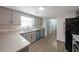 Updated kitchen featuring granite countertops, stainless steel appliances, and gray cabinets at 7156 Whitfield Drive Dr, Riverdale, GA 30296