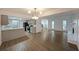 Open-concept living space with modern kitchen, fireplace, and lots of natural light at 7156 Whitfield Drive Dr, Riverdale, GA 30296