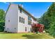 Exterior home view featuring the upper and lower decks and back yard at 1115 Ballington Dr, Cumming, GA 30041