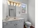 Bright bathroom features a window and ample lighting at 1115 Ballington Dr, Cumming, GA 30041