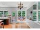 Sun-filled breakfast nook with deck access, and adjacent to kitchen, perfect for casual dining at 1115 Ballington Dr, Cumming, GA 30041