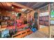 Rustic home music space featuring a drum set, wooden paneling, and unique decorations at 1115 Ballington Dr, Cumming, GA 30041