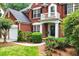 Close up of a beautiful brick home with a lovely landscaped front yard at 1115 Ballington Dr, Cumming, GA 30041